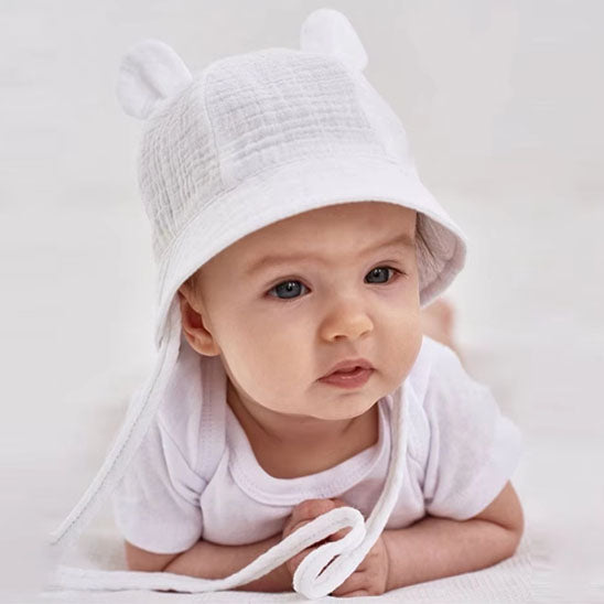 bébé porte sn chapeau bebe blanc