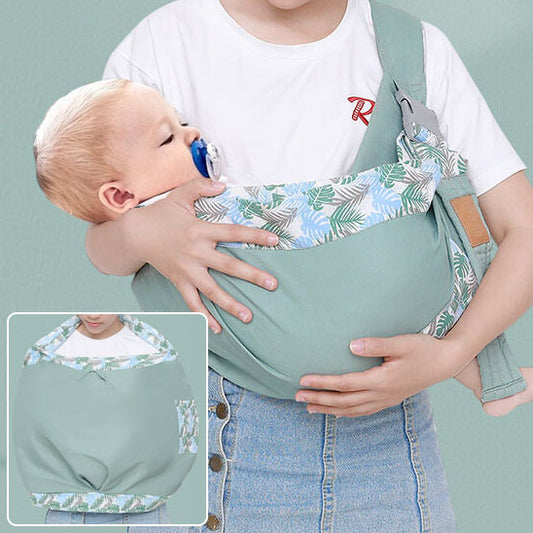 echarpe de portage vert matcha bébé dans les bras de maman