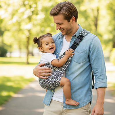 Écharpe de portage avec papa qui porte bébé