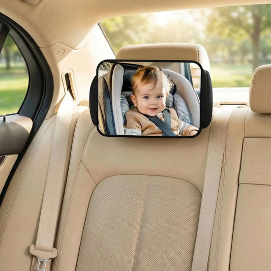 bébé en train de sourir en regardant son papa dans le miroir voiture bébé