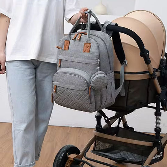 sac à langer bébé attaché à la poussette